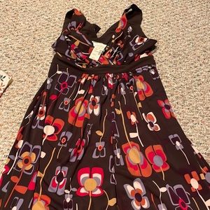 3 dresses all new, worn 1-2 x's. One still tags on it. size range M/L & size 10